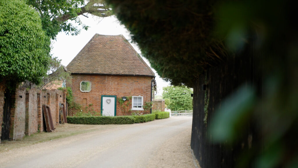 Gaynes Wedding Preparation building sits opposite a row of trees with a love heart decoration on the door